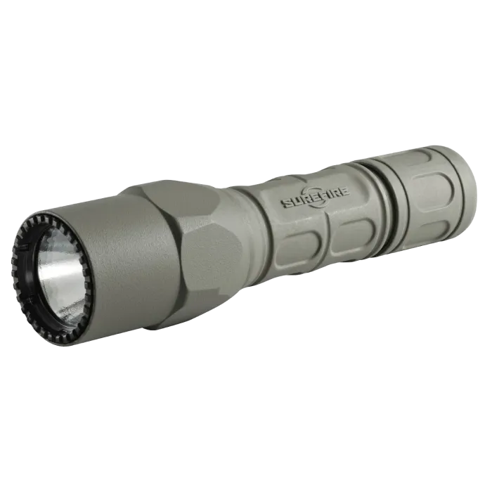 Surefire G2X Pro LED Flashlight in Forest Green, front 3/4 angle showing crenellated bezel and Nitrolon body