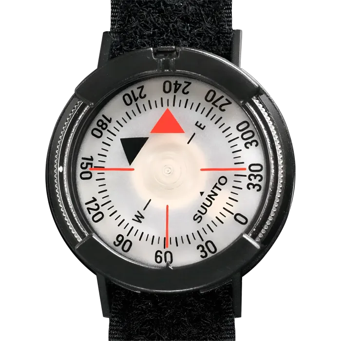 Suunto M-9 wrist compass top view close-up, black bezel, white dial with red north needle and degree markings on black strap