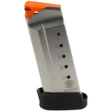 Smith & Wesson M&P Shield 45 7-round magazine side view showing stainless steel body and bright orange follower.