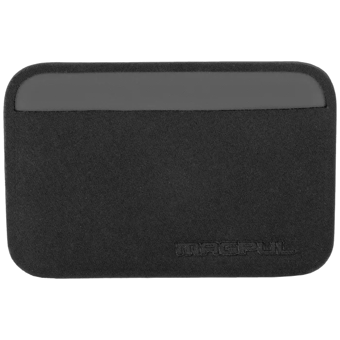 Front view of empty black Magpul Daka Essential Wallet showing slim sleeve design, gray top trim, and embossed logo.