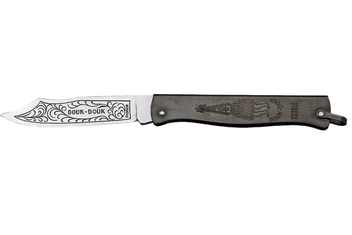 Classic Douk-Douk knife open, showing blackened folded-steel handle and spirit engraving